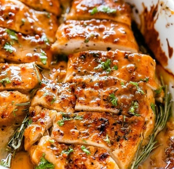 Baked honey mustard chicken served with vegetables on a plate
