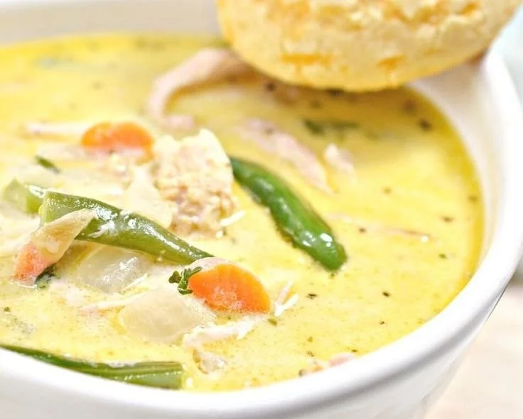 Creamy keto chicken pot pie soup with vegetables in a bowl