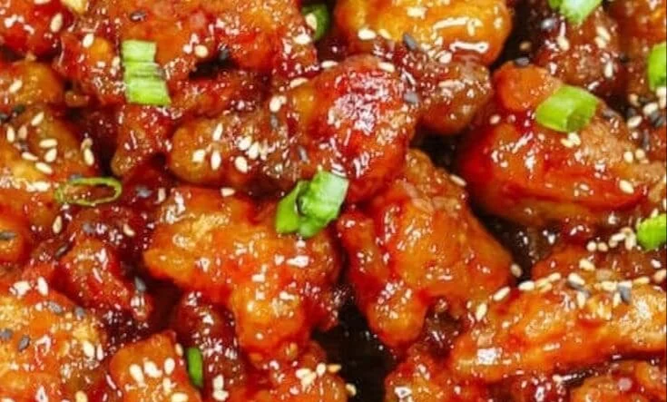 Delicious Easy Instant Pot General Tso's Chicken served with vegetables and rice