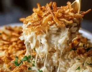French onion chicken rice bake with melted cheese and caramelized onions