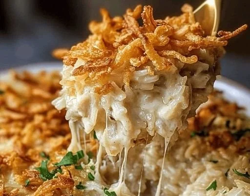 French onion chicken rice bake with melted cheese and caramelized onions