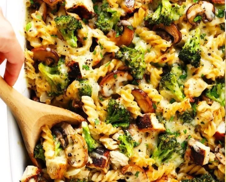 Healthier broccoli chicken casserole served in a baking dish with a green garnish